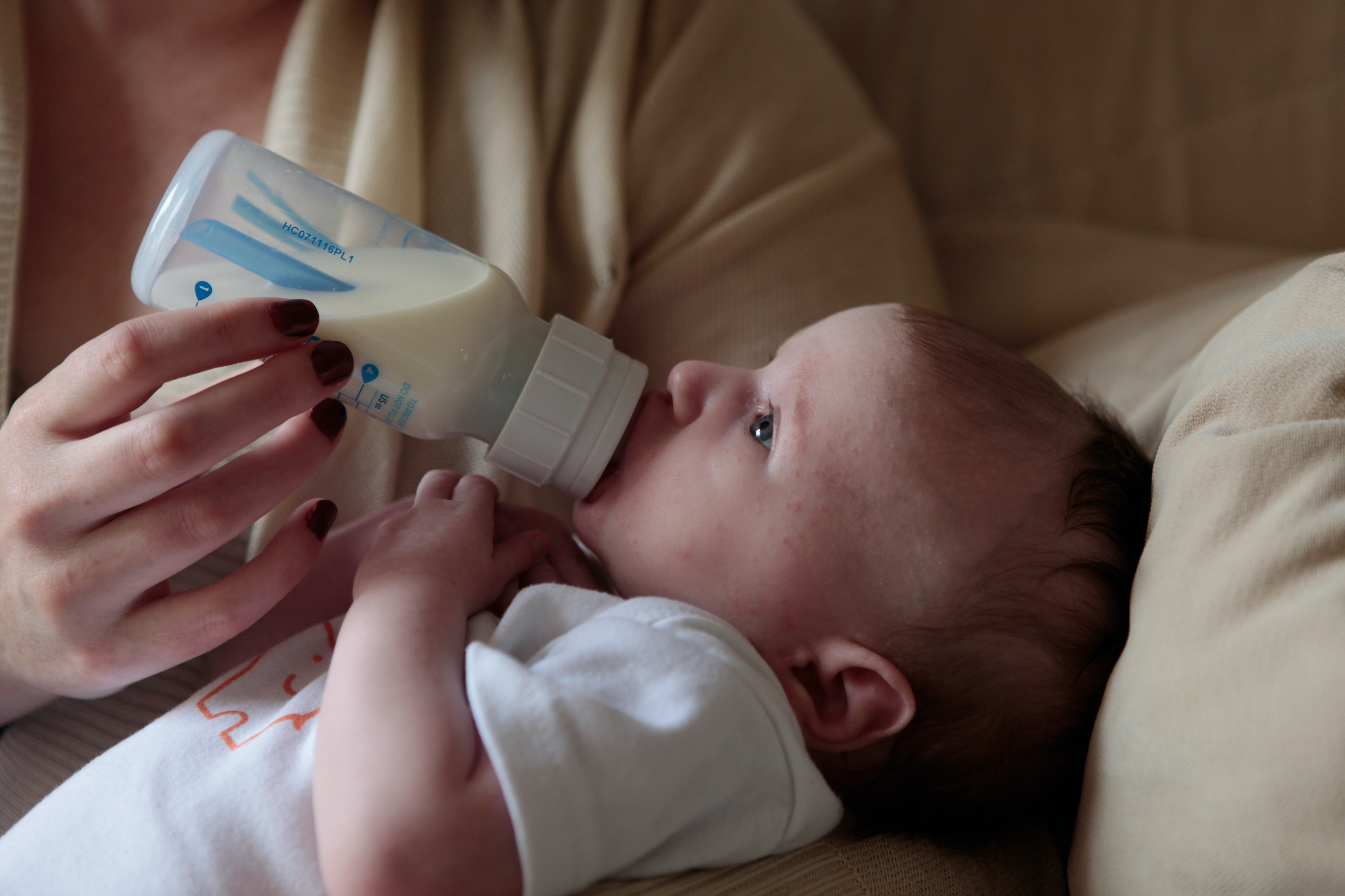 baby being fed a bottle