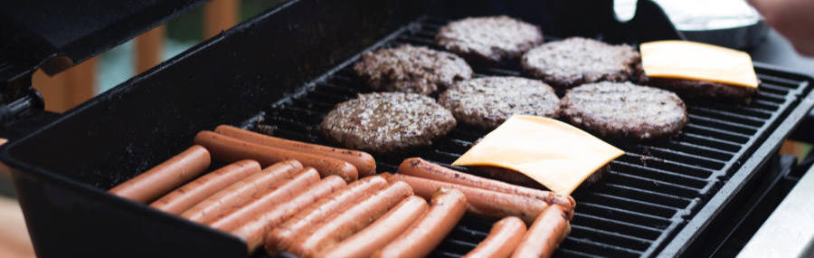 hamburgers and hot dogs on a grill
