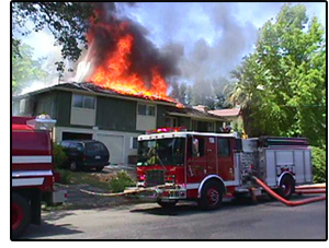 Description: Fire fighters battle house fire