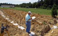 Description: DHEC inspector reviews newly-constructed drainfield.